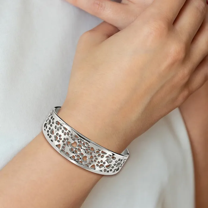 Bracelets TreasureFineJewelers Chisel Stainless Steel Polished Paw Print Cutout Hinged Bangle