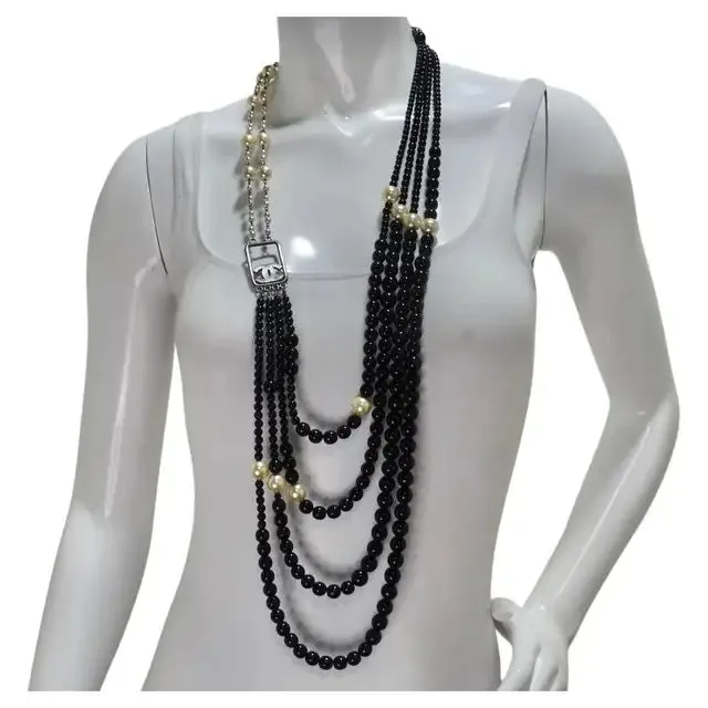 Necklaces Vintage by Misty Chanel 2010 Black and Ivory Resin Pearl Multi Strand CC Logo Necklace Necklaces Vintage by Misty Chanel 2010 Black and Ivory Resin Pearl Multi Strand CC Logo Necklace